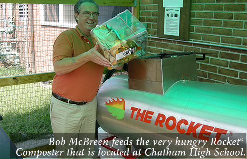 Bob McBreen feeds the very hungry Rocket?? Composter that is located at Chatham High School.