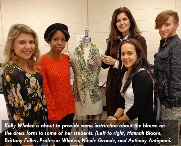 Image of Kelly Whalen who is about to provide some instruction about the blouse on the dress form to some of her students. (Left to right) Hannah Bloom, Brittany Fuller, Professor Whalen, Nicole Grande, and Anthony Antignani.